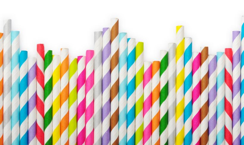 Colourful biodegradable straws in a row